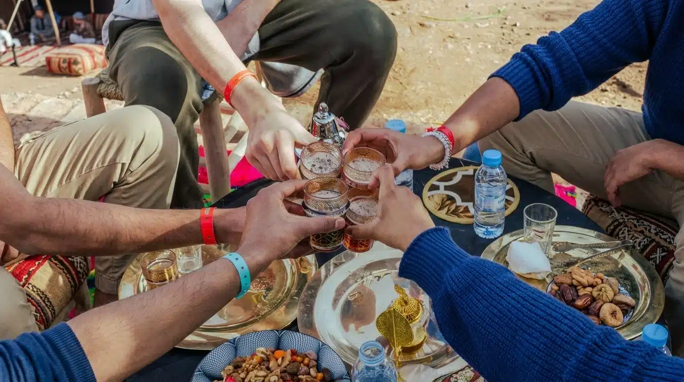 A beautifully set table with traditional Moroccan tea and pastries overlooking the Atlas Mountains
